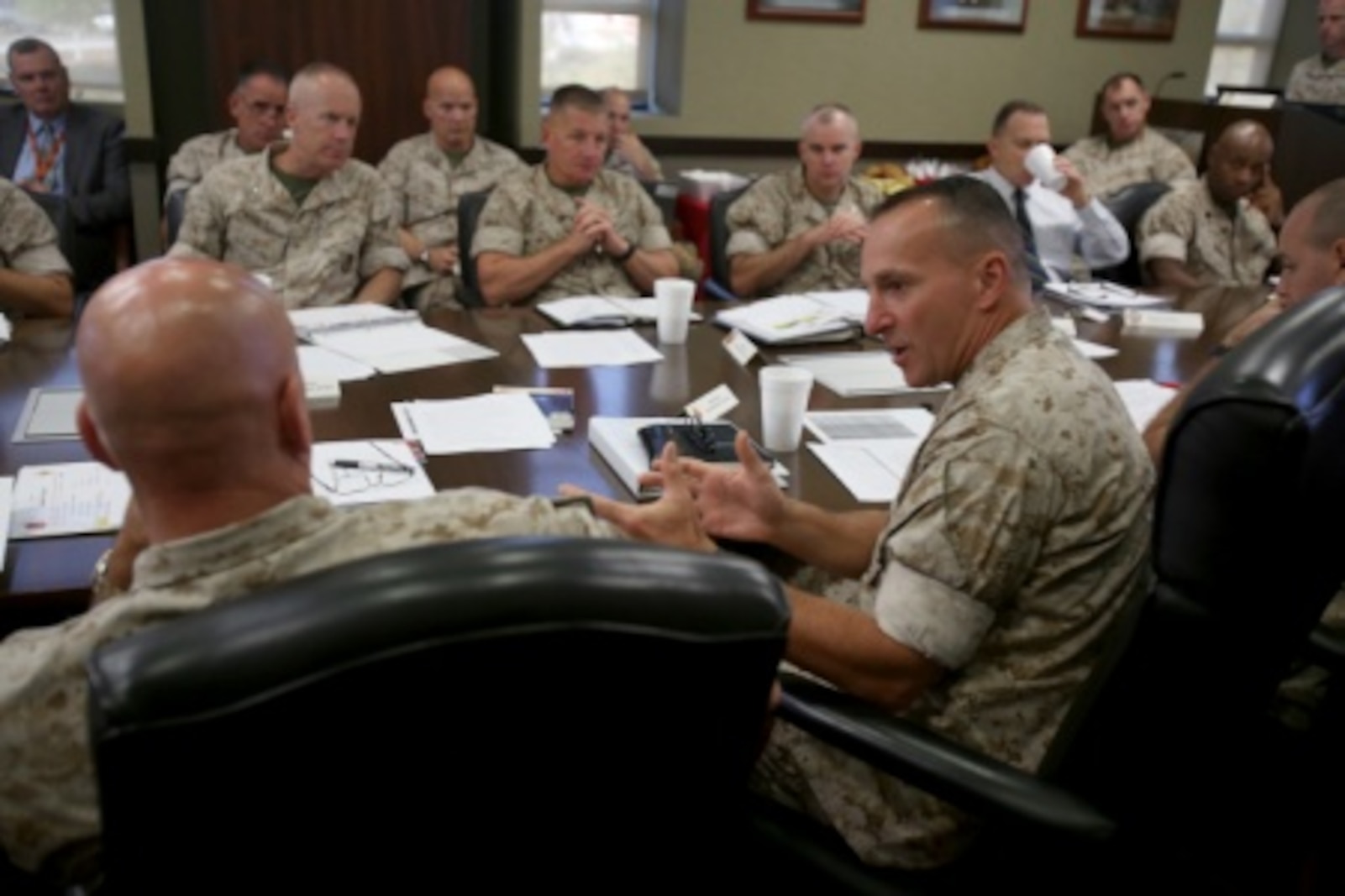 Brigadier General David A. Ottignon, commanding general, 1st Marine Logistics Group, and Brig. General Charles G. Chiarotti, commanding general, 2nd MLG, discuss organizational details during a Quad MLG Conference where the commanding generals of the four Marine Logistics Groups came together in an effort to plan for future organization and logistic changes that will affect their units, aboard Camp Pendleton Calif., Oct. 7, 2015. The four general officers discussed various topics and proposed plans that will help them stay on the same page while simultaneously operating within their specific operational capabilities and capacities.