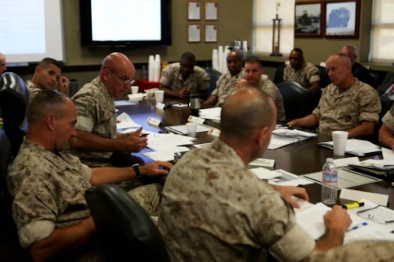 Brigadier General David A. Ottignon, commanding general, 1st Marine Logistics Group, explains his thoughts during a Quad MLG Conference where the commanding generals of the four MLGs came together in an effort to plan for future organization and logistic changes that will affect their units, aboard Camp Pendleton Calif., Oct. 7, 2015. The four general officers discussed various topics and proposed plans that will help them stay on the same page while simultaneously operating within their specific operational capabilities and capacities.
