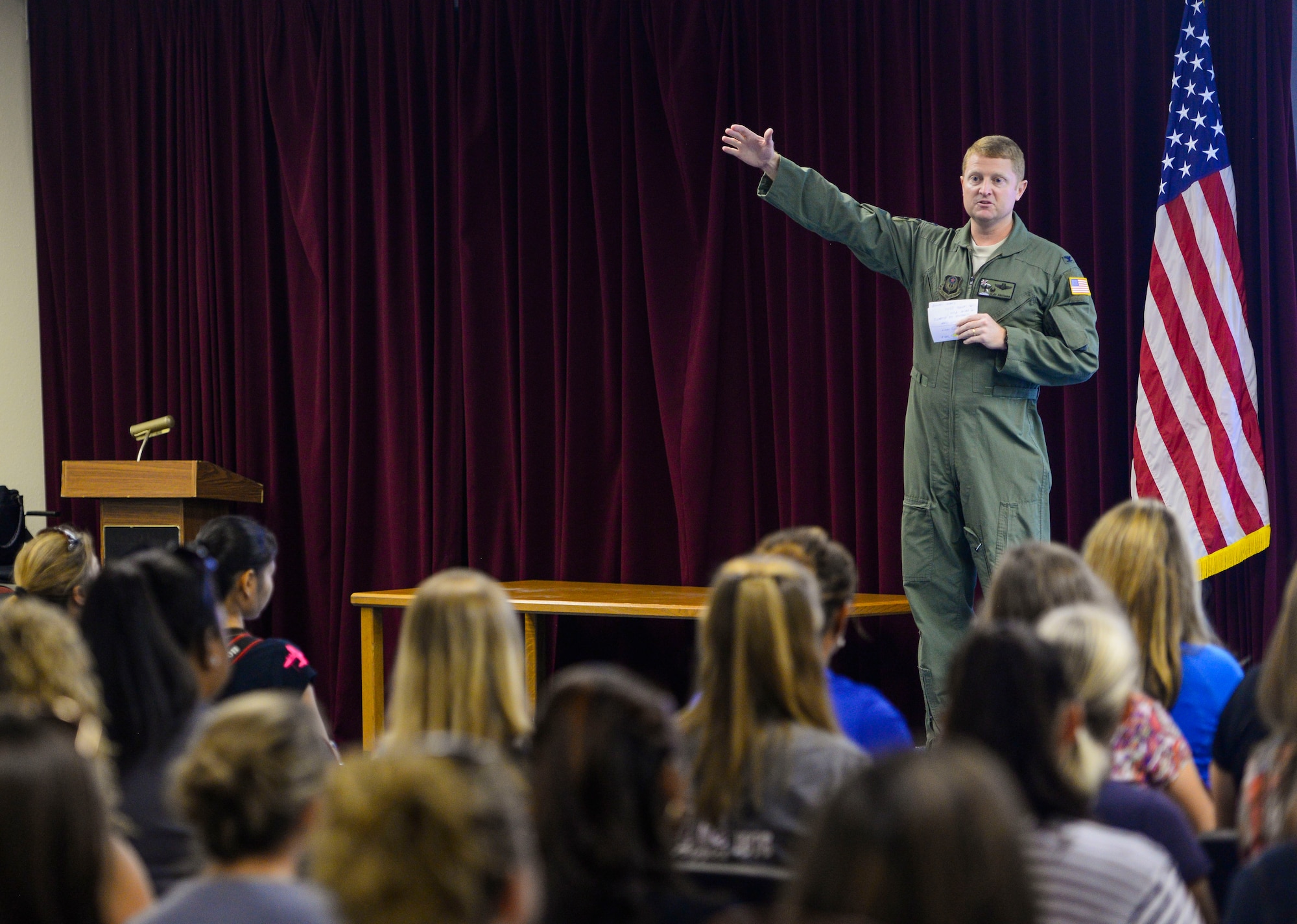 U.S. Air Force Col. William C. Freeman, 353rd Special Operations Group commander, speaks to spouses during a spouse orientation day Oct. 8, 2015, on Kadena Air Base, Japan. The spouses were provided a mission capabilities brief, a tour of the 320th Special Tactics Squadron and orientation flights on an MC-130J Commando II and MC-130H Combat Talon II during the event. (U.S. Air Force photo by Senior Airman John Linzmeier)