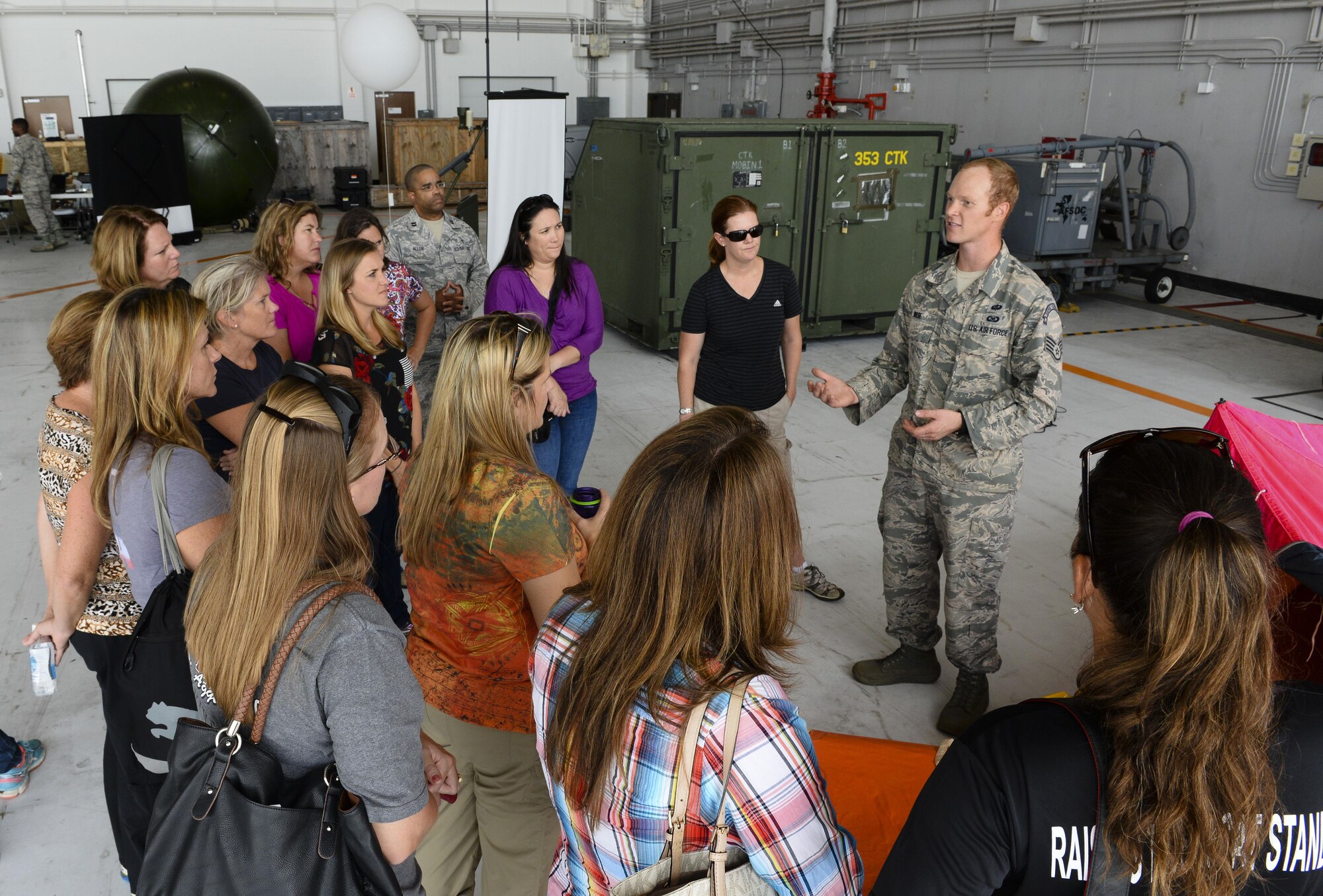 U.S. Air Force Staff Sgt.Tyler Wise, 353rd Special Operations Support Squadron, Survival, Evasion, Resistance and Escape specialist answers questions from 353rd Special Operations Group spouses during a spouse orientation day Oct. 8, 2015, on Kadena Air Base, Japan. The men and women who comprise the 353rd SOG conduct a variety of high-priority, low-visibility missions. The unit’s Airmen are frequently called upon to leave the island for deployments, temporary duty assignments and additional training. (U.S. Air Force photo by Senior Airman John Linzmeier)