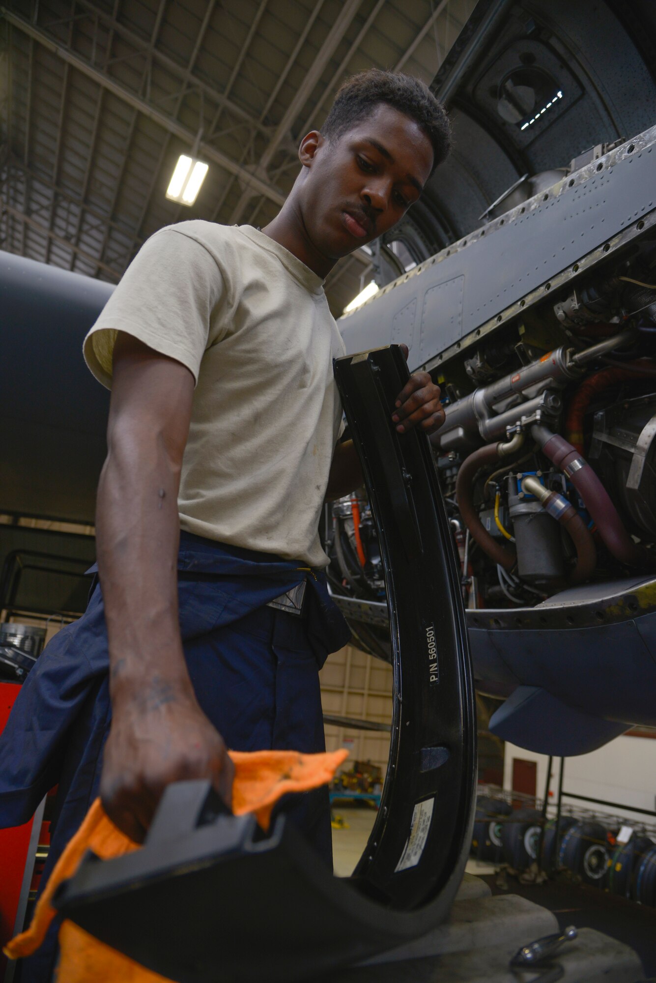 Senior Airman Amari Palmer, 374th Maintenance Squadron airspace propulsion journeyman, cleans a C-130 Hercules propeller panel at Yokota Air Base, Japan, Oct. 6, 2015. The 14-day isochronal inspection is split into four phases: look phase, fix phase, re-inspection phase and the quality assurance phase. (U.S. Air Force photo by Senior Airman David Owsianka/Released)