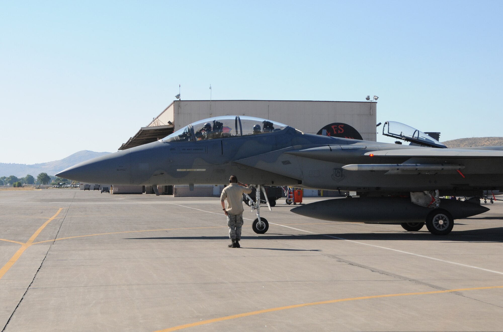 An F-15C from the 173rd Fighter Wing taxis out to the flight line with a  in preparation for a high speed  taxi ride arranged for spouses of maintenance group members, Oct. 4, 2015 at Kingsley Field, Ore. During the morning 20 spouses saw first-hand the result of their significant others’ work on a day-to-day basis. (U.S. Air National Guard photo by Tech. Sgt. Jefferson Thompson/released)