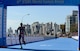 U.S. Air Force Maj. Judith Coyle crosses the finish line of the women's triathlon in downtown Pohang, South Korea, during the CISM World Games Oct. 10, 2015. Coyle earned bronze for the USA in the seniors division with an overall time of two hours, 15 minutes and  27.69 seconds. (U.S. Armed Forces Sports photo by Gary Sheftick)