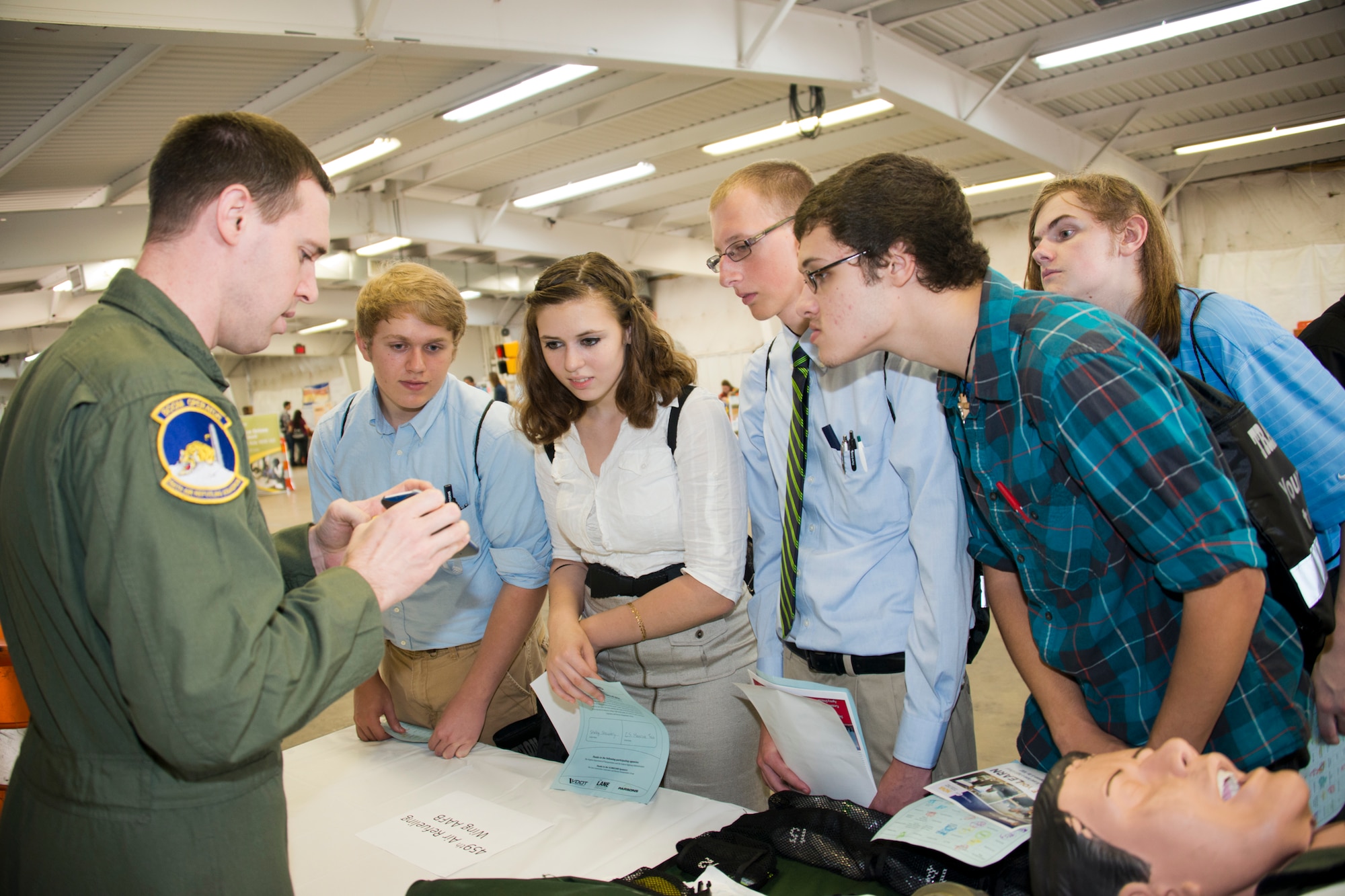 Tech. Sgt. Matt Oberlin, 756th Refueling Squadron boom operator, inform students about a career as boom operator at the 11th annual Virginia Department of Transportation Career Fair at Prince William County Fairgrounds Oct. 8, 2015. The event, which drew more than 1,300 students from the Prince William County area, provided an opportunity for youths to learn about careers in the transportation industry. The 459th was on hand to discuss potential career paths as pilots, boom operators and inflight medics. (U.S. Air Force photo by Staff Sgt. Kat Justen)