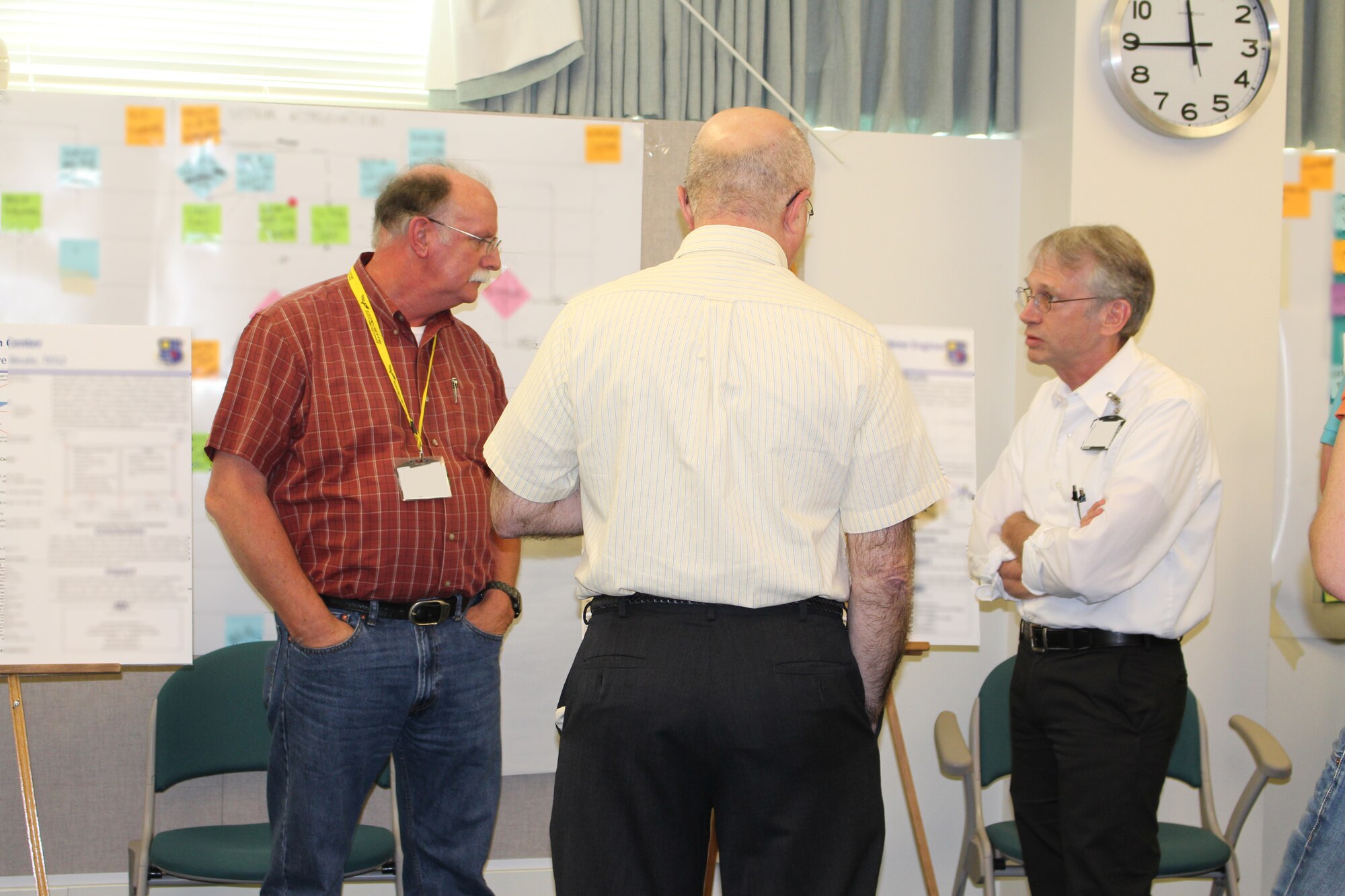 Technical poster sessions are held regularly to highlight the projects completed at AEDC with the help of funding from the Innovation Grant Program. Recently, the third annual session was held allowing personnel to explain their proposals and answer questions about their work. David Beale, AEDC Fellow and ATA senior engineer, pictured at right, describes his Innovation Grant project to colleagues.  (Photo by Deidre Ortiz)