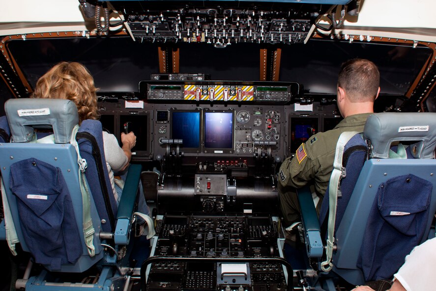 Carol Pruett, a Travis Honorary Commander, pilots a C-5M Super Galaxy simulator Oct. 2 during the 60th Operations Group community leader tour at Travis Air Force Base, Calif. (U.S. Air Force photo/Senior Airman Charles Rivezzo)
