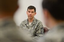 Chief Master Sgt. Keith Davis, 436th Airlift Wing command chief, listens to a question from an Airman attending a professional development session titled, "Every Airman has a Story," Oct. 8, 2015, at Dover Air Force Base, Del. Davis told his story and then took questions from the audience of Team Dover enlisted members. (U.S. Air Force photo/Greg L. Davis)