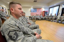 Master Sgt. Joseph Moran, 436th Logistics Readiness Squadron, NCO-in-charge multi-purpose maintenance, listens to Chief Master Sgt. Keith Davis', 436th Airlift Wing command chief, story with other Team Dover enlisted personnel during a professional development session titled, "Every Airman has a Story," Oct. 8, 2015, at Dover Air Force Base, Del. Moran was one of many senior enlisted leaders who attended the session which was intended to educate and inspire others by getting to know their fellow Airman's personal stories. (U.S. Air Force photo/Greg L. Davis)