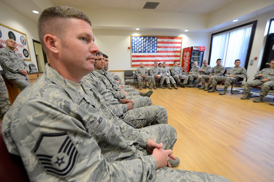 Master Sgt. Joseph Moran, 436th Logistics Readiness Squadron, NCO-in-charge multi-purpose maintenance, listens to Chief Master Sgt. Keith Davis', 436th Airlift Wing command chief, story with other Team Dover enlisted personnel during a professional development session titled, "Every Airman has a Story," Oct. 8, 2015, at Dover Air Force Base, Del. Moran was one of many senior enlisted leaders who attended the session which was intended to educate and inspire others by getting to know their fellow Airman's personal stories. (U.S. Air Force photo/Greg L. Davis)