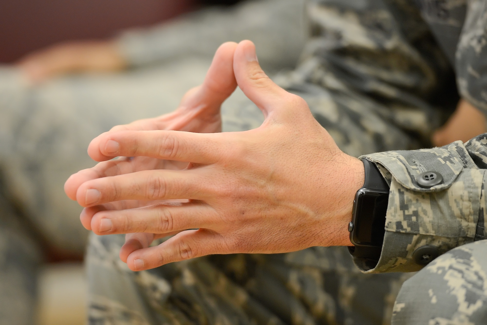 Pictured is a close-up of the hands of Chief Master Sgt. Keith Davis, 436th Airlift Wing command chief, as he makes a point during a professional development session titled, "Every Airman has a Story," Oct. 8, 2015, at Dover Air Force Base, Del. Davis has been the command chief at DAFB since June of this year. (U.S. Air Force photo/Greg L. Davis)