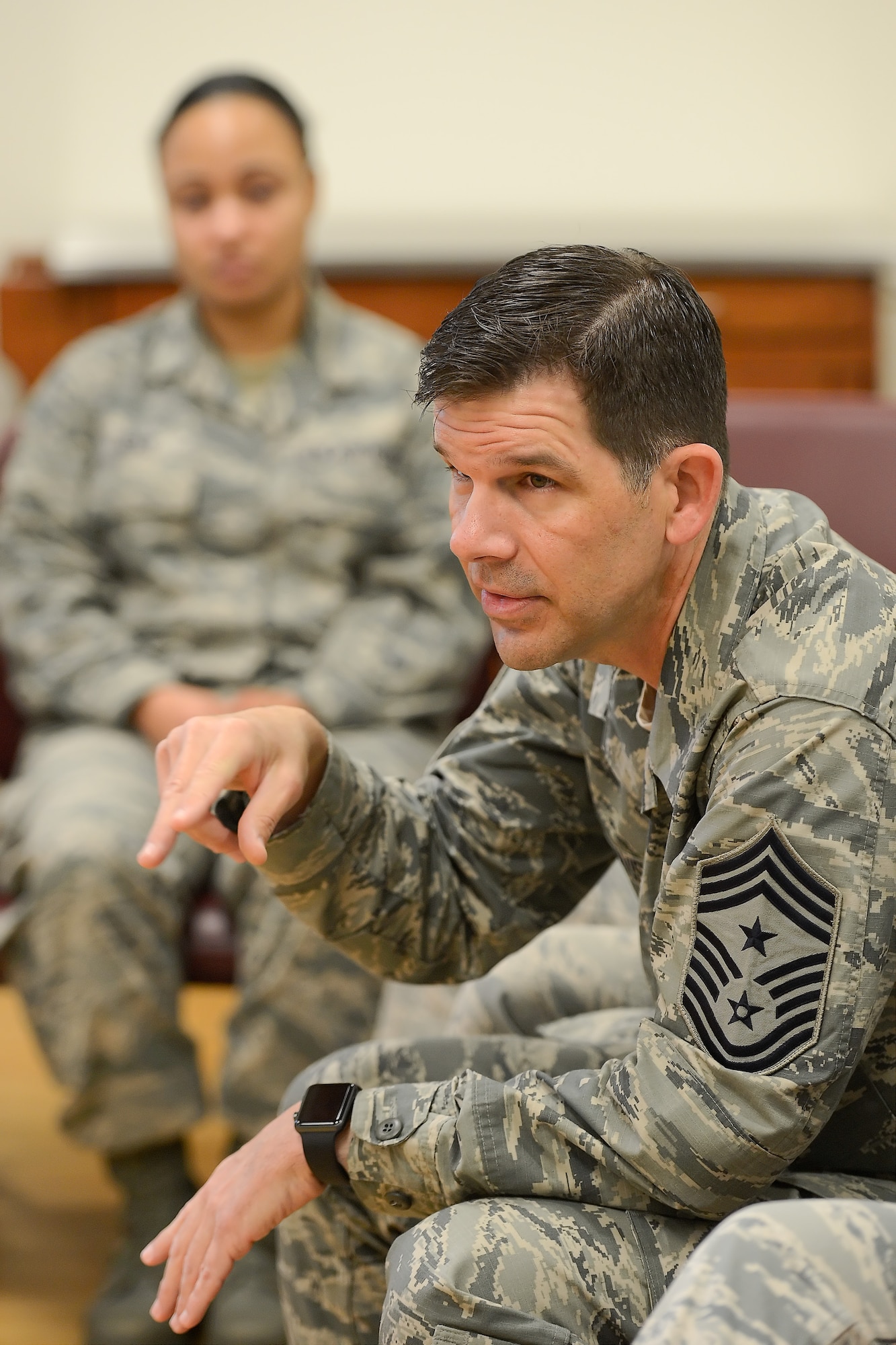 Chief Master Sgt. Keith Davis, 436th Airlift Wing command chief, tells his story to a group of Team Dover enlisted personnel during a professional development session titled, "Every Airman has a Story," Oct. 8, 2015, at Dover Air Force Base, Del. Davis told the audience of his challenging childhood, how he was inspired to succeed in life and reach the pinnacle of enlisted ranks within the Air Force. (U.S. Air Force photo/Greg L. Davis)