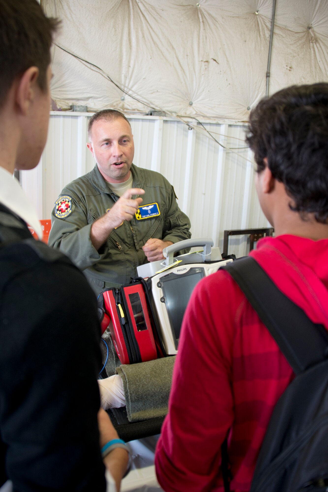 Tech Sgt. Carl Stewart II, 459th Aeromedical Evacuation Squadron aeromedical evacuation technician, inform a students about a career as an air transport medic at the 11th annual Virginia Department of Transportation Career Fair at Prince William County Fairgrounds Oct. 8, 2015. The event, which drew more than 1,300 students from the Prince William County area, provided an opportunity for youths to learn about careers in the transportation industry. The 459th was on hand to discuss potential career paths as pilots, boom operators and inflight medics. (U.S. Air Force photo by Staff Sgt. Kat Justen)