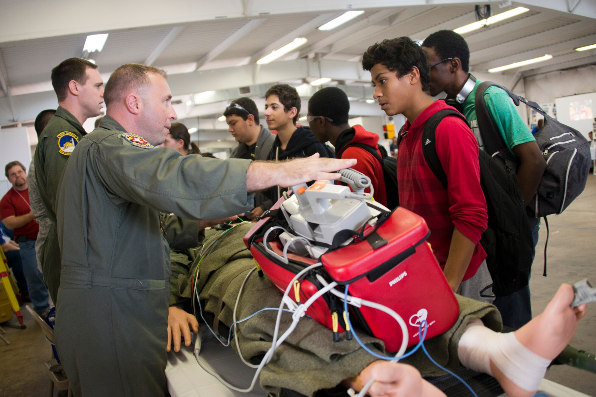 Tech Sgt. Carl Stewart II, 459th Aeromedical Evacuation Squadron aeromedical evacuation technician, informs students about a career as an air transport medic at the 11th annual Virginia Department of Transportation Career Fair at Prince William County Fairgrounds Oct. 8, 2015. The event, which drew more than 1,300 students from the Prince William County area, provided an opportunity for youths to learn about careers in the transportation industry. The 459th was on hand to discuss potential career paths as pilots, boom operators and inflight medics. (U.S. Air Force photo by Staff Sgt. Kat Justen)