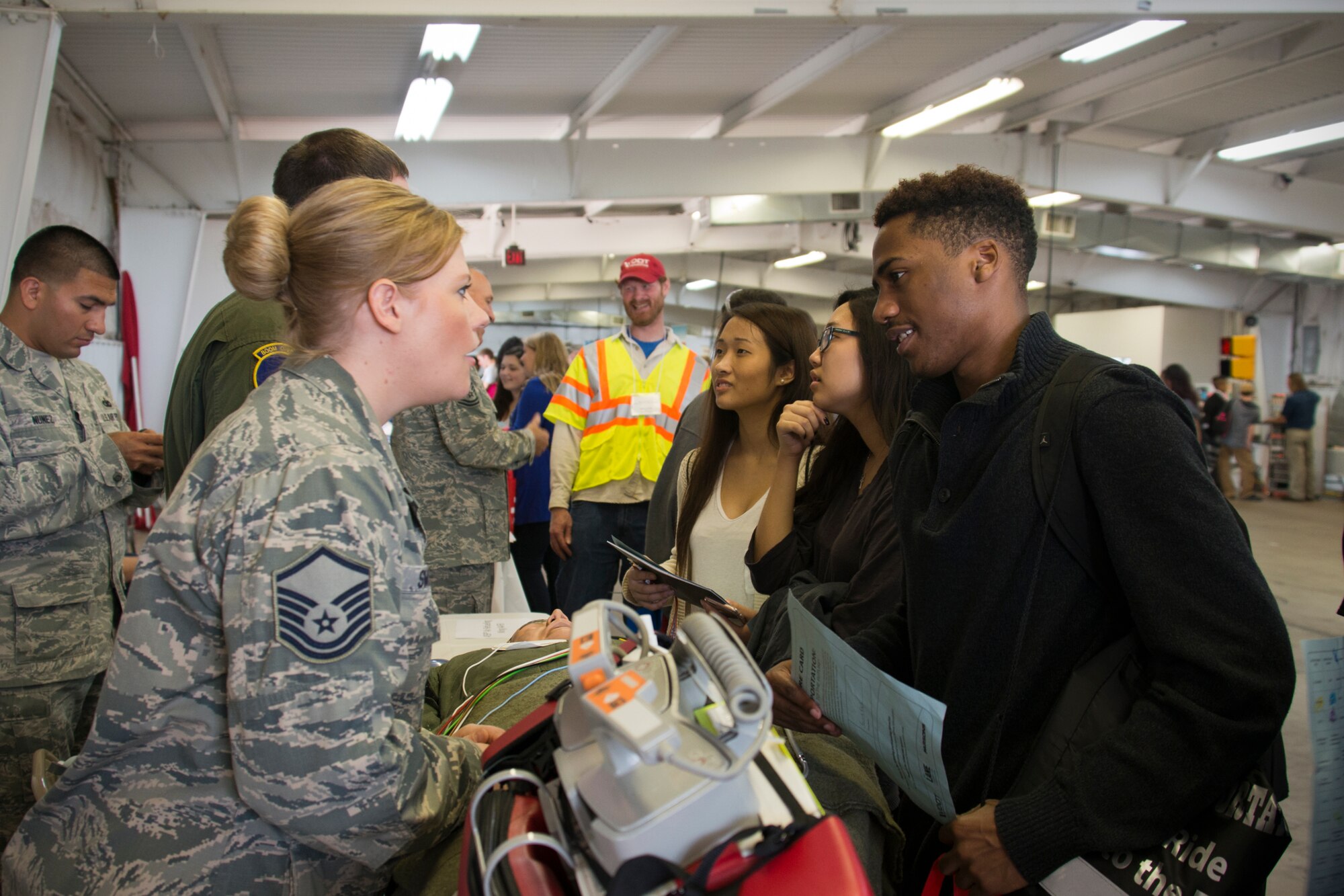 Master Sgt. Melissa Smolka, 459th Aeromedical Evacuation Squadron training manager, informs a student about a career as an air transport medic at the 11th annual Virginia Department of Transportation Career Fair at Prince William County Fairgrounds Oct. 8, 2015. The event, which drew more than 1,300 students from the Prince William County area, provided an opportunity for youths to learn about careers in the transportation industry. The 459th was on hand to discuss potential career paths as pilots, boom operators and inflight medics. (U.S. Air Force photo by Staff Sgt. Kat Justen)