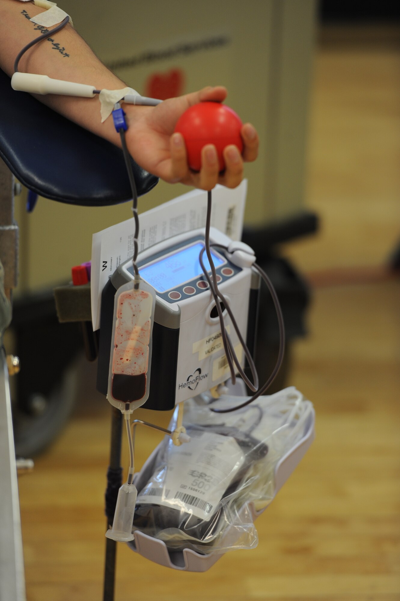 Airman 1st Class Landen Young, 5th Civil Engineer Squadron engineering apprentice donates blood during a blood drive held at the McAdoo Fitness Center at Minot Air Force Base, N.D., Oct. 9, 2015. Members from the base volunteered their time to donate blood in support of hospitals across N.D. (U.S. Air Force photo/Senior Airman Kristoffer Kaubisch)