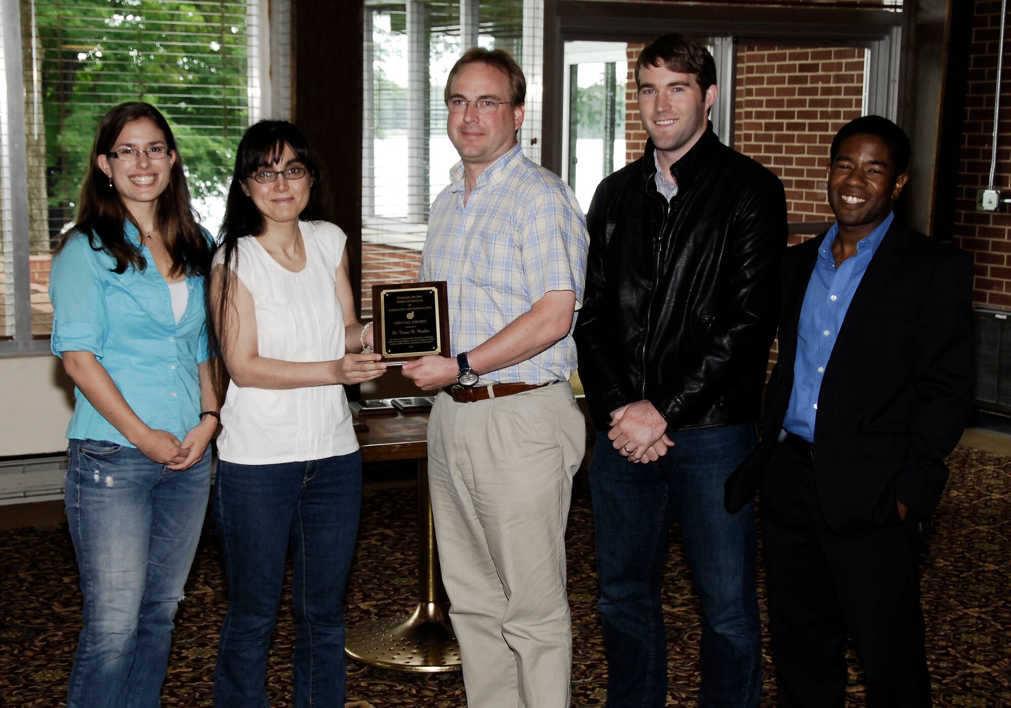 University of Tennessee Space Institute (UTSI) Professor Trevor Moeller (center) receives an AIAA Tennessee Section Special Award for outstanding student advising and mentoring efforts from UTSI nominators (left to right) Lara Lash, Densu Atkas, James Rodgers and Nehemiah Williams.