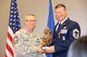 A final tribute from the Chief's Group at the unit went to Chief Master Sgt. James Hutto (at right) who was happy and pleased to receive this memento of service from Chief Master Sgt. Kevin Pomeroy of the 932nd Operations Group.  Hutto retired during the October Unit Training Assembly drill weekend after many years of service with the 932nd Airlift Wing located in Illinois.  (U.S. Air Force photo/Maj. Stan Paregien)