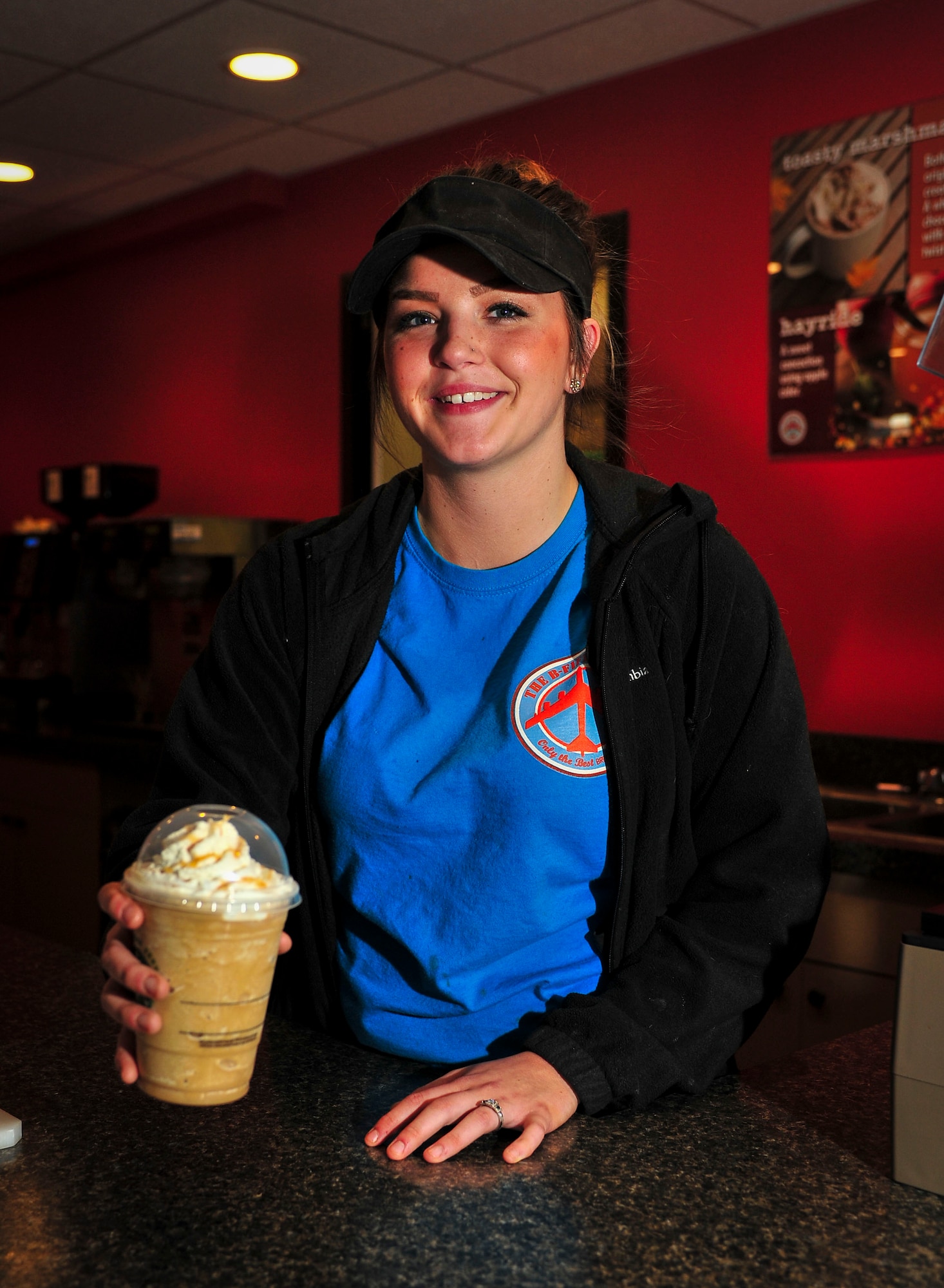 Britany Fithian, barista, makes and serves coffee at the B-Fifty Brew at Minot Air Force Base, N.D., Oct. 7, 2015. The Brew, which falls under the 5th Force Support Squadron, offers a variety of pastries as well as both hot and cold coffee and drinks. The hours of operation for the facility are Monday through Friday 6 a.m. to 6 p.m. and 8 a.m. to 2 p.m. on the weekends. (U.S. Air Force photo/Senior Airman Stephanie Morris)