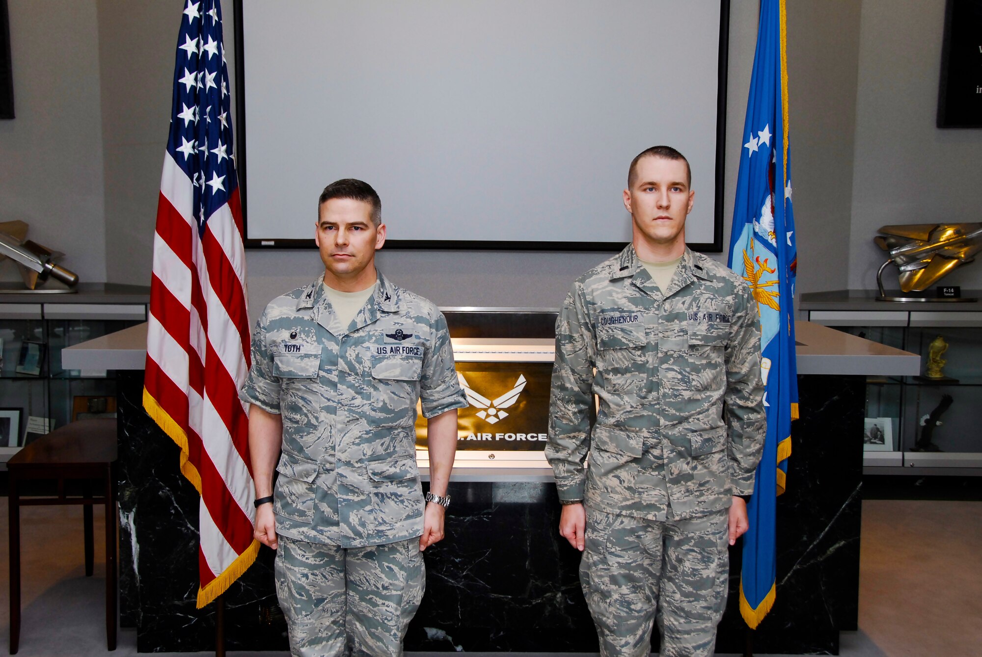 Capt. Joshua Coughenour (right), joined by AEDC Commander Col. Raymond Toth, prepares to be pinned while the official promotion order is read at his promotion ceremony to captain on May 21.