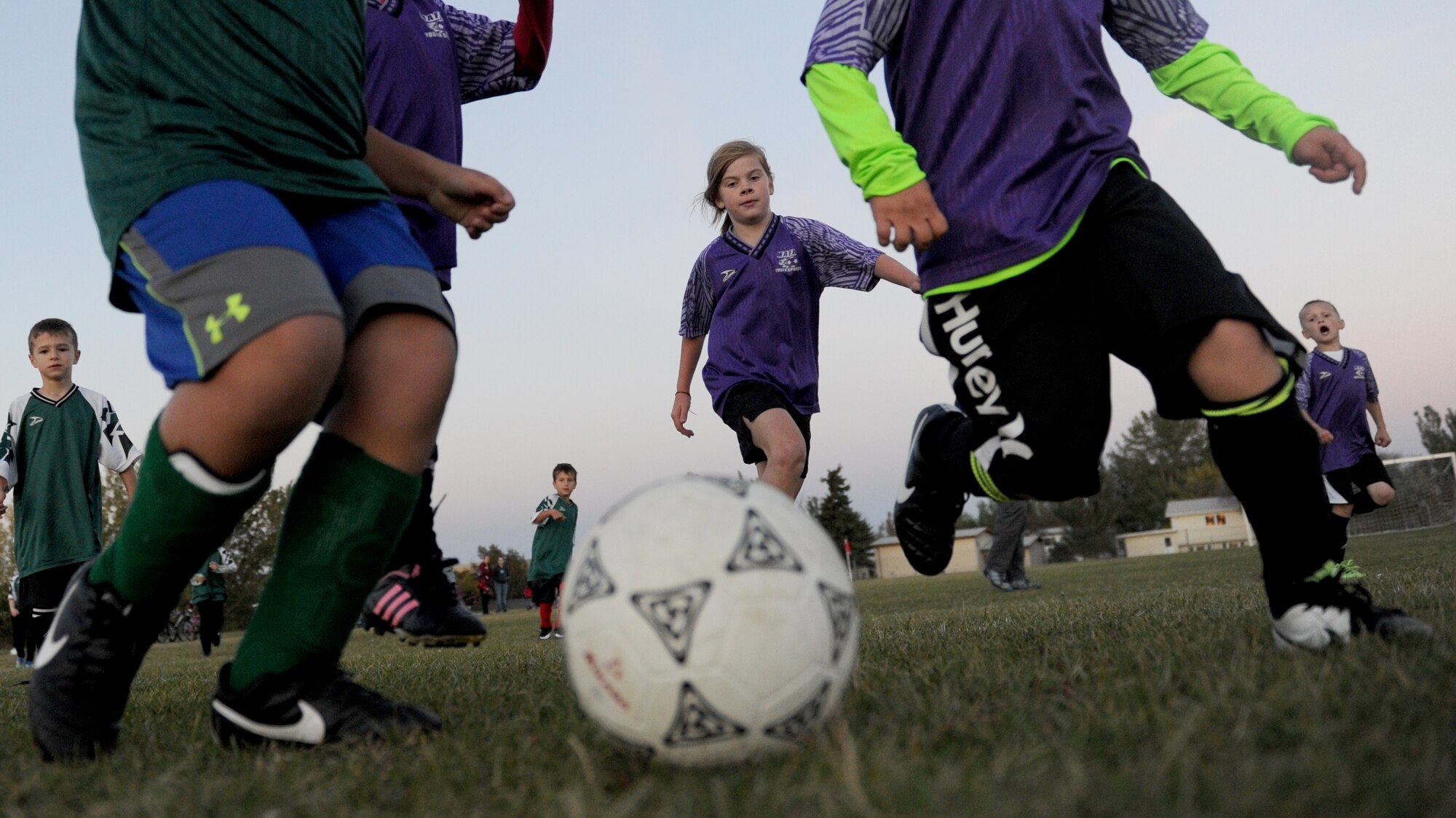 Children from the youth center play soccer at Minot Air Force Base, N.D. Oct. 6, 2015. The children were playing their final soccer game of the season which is part of many programs and activities the youth center provides. (U.S. Air Force photo by Staff Sgt. Chad Trujillo)