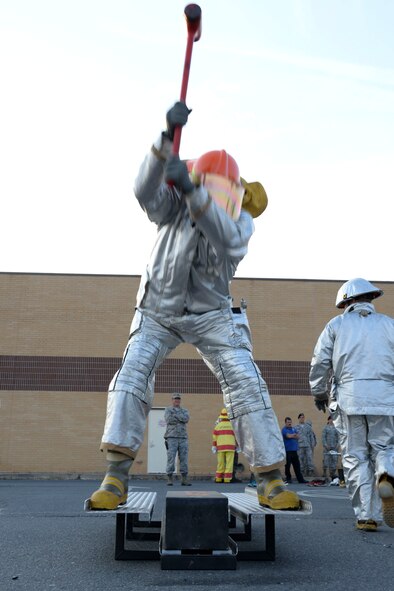 An Airman participates in the Keiser Sled challenge during the fire muster competition at Barksdale Air Force Base, La., Oct. 8, 2015. The obstacles allowed competitors to experience different tasks and techniques firefighters require to fight fires safely and successfully. This obstacle mimics forcible entry. (U.S. Air Force photo/Senior Airman Amanda Morris) 