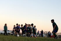 Children from the youth center play soccer at Minot Air Force Base, N.D. Oct. 6, 2015. The children were playing their final soccer game of the season which is part of many programs and activities the youth center provides. (U.S. Air Force photo by Staff Sgt. Chad Trujillo)