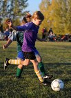 Children from the youth center play soccer at Minot Air Force Base, N.D. Oct. 6, 2015. The children were playing their final soccer game of the season which is part of many programs and activities the youth center provides. (U.S. Air Force photo by Staff Sgt. Chad Trujillo)