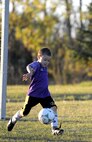 Ashton Trujillo kicks a soccer ball at Minot Air Force Base, N.D. Oct. 6, 2015. The youth center on base provides many programs activities for the children on Minot Air Force Base. (U.S. Air Force photo by Staff Sgt. Chad Trujillo)
