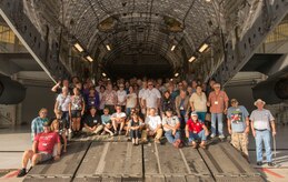 Vietnam War veterans stand together on a C-17 Globemaster III in a hangar at Joint Base Charleston – Air Base, S.C., on Oct. 10, 2015. The veterans traveled to JB Charleston for a Vietnam veteran base tour. (U.S. Air Force photo/Airman 1st Class Thomas T. Charlton)