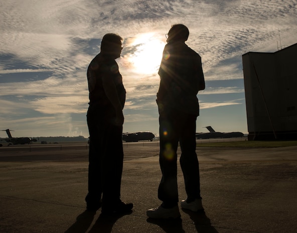 (From left to right) Vietnam War veterans Lou Ruggiero and Jack Bachman reminisce on the flight line at Joint Base Charleston – Air Base, S.C., on Oct. 10, 2015 during a  base tour. Before retirement, Ruggiero was a Sgt. from supply and Bachman was a Sgt. from munitions and maintenance. (U.S. Air Force photo/Airman 1st Class Thomas T. Charlton)