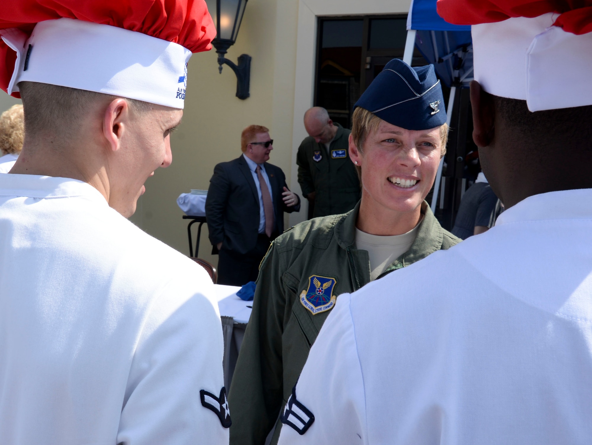 Col. Kristin Goodwin, 2nd Bomb Wing commander, congratulates Airmen for their efforts during the Global Strike Challenge Chef Competition at Barksdale Air Force Base, La., Oct. 7, 2015. Competitors from each base in Air Force Global Strike Command participated in the first GSC chef competition. Using chicken and green apples as inspiration, each team prepared an entrée and a dessert for 11 judges. (U.S. Air Force photo/Senior Airman Amanda Morris)