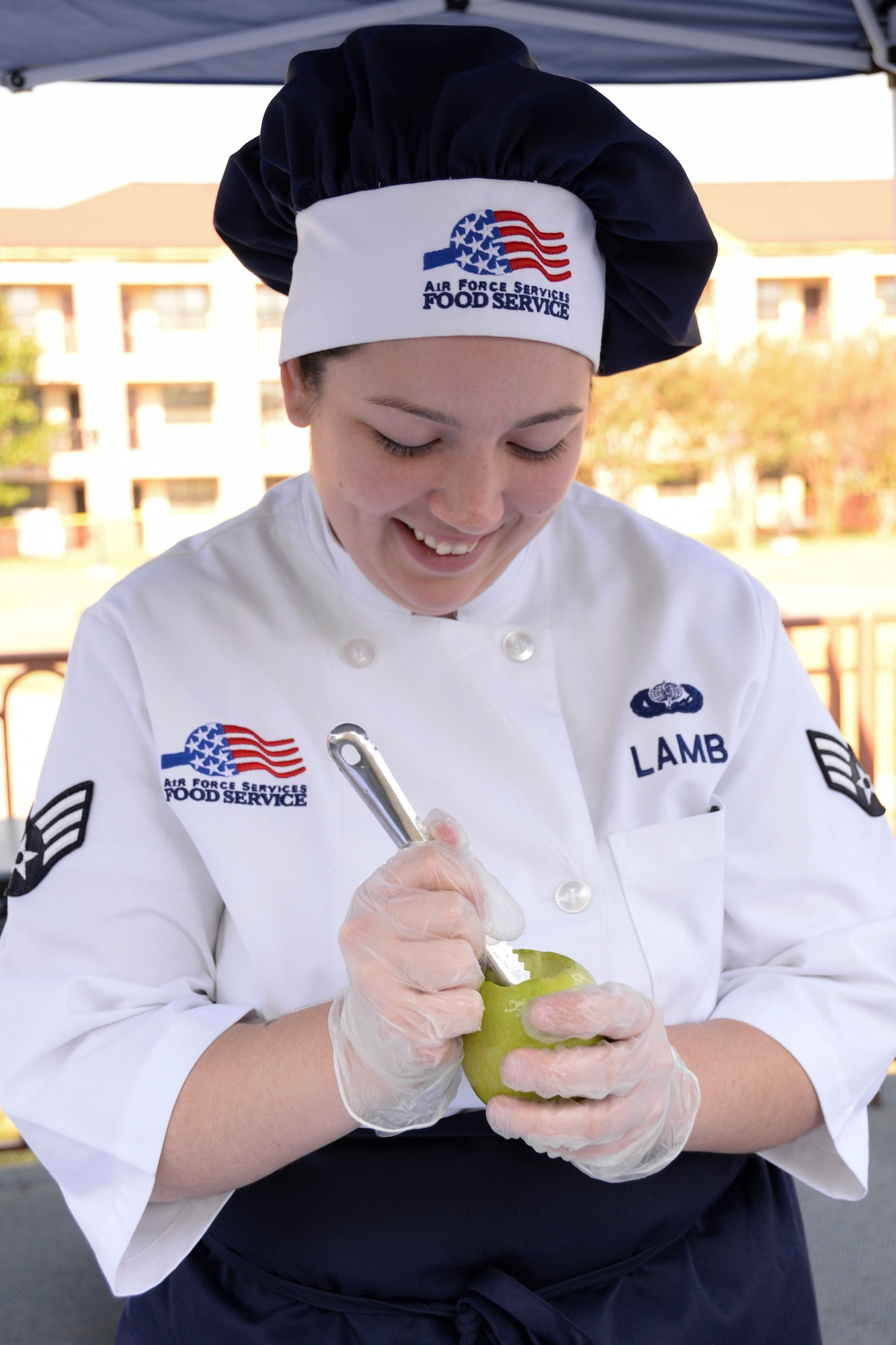 Senior Airman Tiffany Lamb, 7th Force Support Squadron food services specialist from Dyess Air Force Base, Texas, hollows out an apple during the Global Strike Challenge Chef Competition at Barksdale Air Force Base, La., Oct. 7, 2015. Lamb was one of 21 Airmen selected from bases in Air Force Global Strike Command who participated in the competition. (U.S. Air Force photo/Senior Airman Amanda Morris)