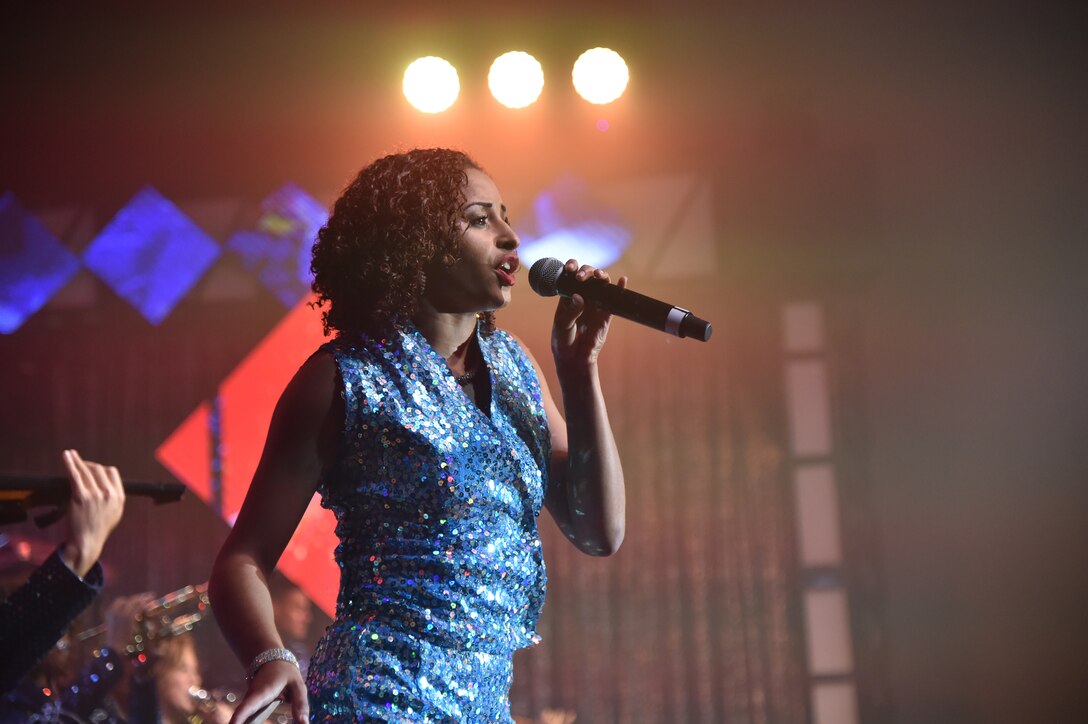 2nd Lt. Nicque Robinson, 319th Contracting Flight contracting specialist, sings at the Joint Base Andrews’, Md., base theater, October 2, 2015. Tops in Blue serves as an expeditionary entertainment unit to provide entertainment from within Air Force resources for the Air Force family, with priority to Air Force personnel stationed world-wide at remote and deployed locations. (U.S. Air Force photo/ Airman 1st Class J.D. Maidens/ released)