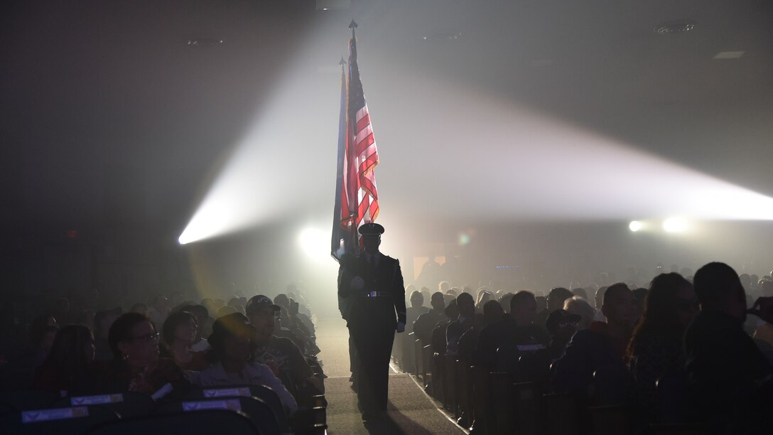 Tops in Blue honor guardsmen present the colors at the Joint Base Andrews’, Md., base theater, October 2, 2015. Tops in Blue serves as an expeditionary entertainment unit to provide entertainment from within Air Force resources for the Air Force family, with priority to Air Force personnel stationed world-wide at remote and deployed locations. (U.S. Air Force photo/ Airman 1st Class J.D. Maidens/ released)