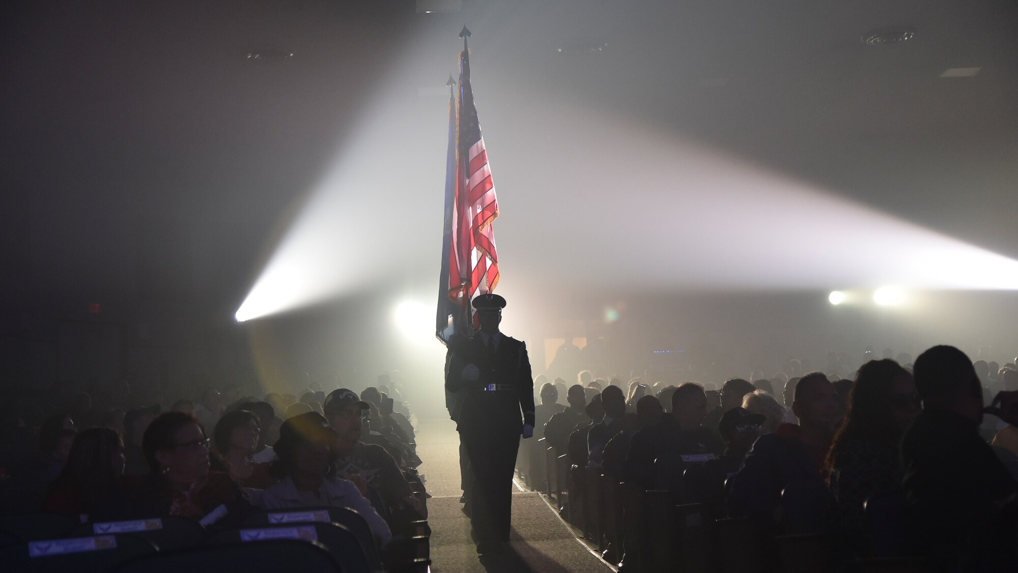 Tops in Blue honor guardsmen present the colors at the Joint Base Andrews’, Md., base theater, October 2, 2015. Tops in Blue serves as an expeditionary entertainment unit to provide entertainment from within Air Force resources for the Air Force family, with priority to Air Force personnel stationed world-wide at remote and deployed locations. (U.S. Air Force photo/ Airman 1st Class J.D. Maidens/ released)