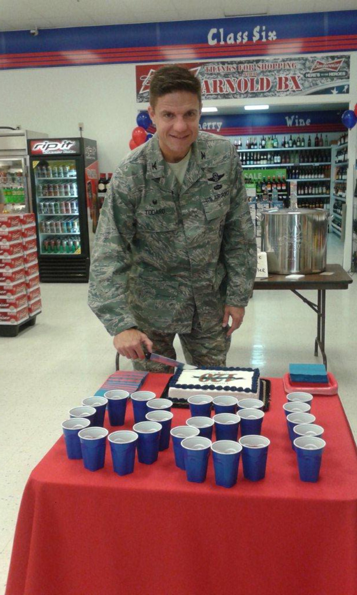 AEDC Commander Col. Rodney Todaro cuts the cake at the celebration for the 120th Anniversary of the Army and Air Force Exchange Service July 25. The event was held at the Arnold Air Force Base Exchange. (Photo provided)
