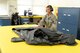 U.S. Air Force Senior Airman Cheyenne Feazelle, 20th Operation Support Squadron aircrew flight equipment specialist, inspects a life raft at Shaw Air Force Base, S.C., Oct. 6, 2015. Life rafts are installed in the survival kits that are installed underneath the ejection seat. During man seat separation, the weight of the survival kit actuates the mechanism on top of the carbon dioxide cylinder attached to the raft, forcing it to inflate before it hits the water.  (U.S. Air Force photo by Airman 1st Class Christopher Maldonado/Released)