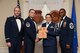 U.S. Air Force Senior Airman Hailey Booth, 31st Intelligence Squadron, receives a distinguished graduate award for the Senior Master Sgt. David B. Reid Airman Leadership School Class 15-7 from Master Sgt. Ryan Glosson, 372nd Recruiting Squadron first sergeant, at Shaw Air Force Base, S.C., Oct. 9, 2015. The distinguished graduate awards are given to the top 10 percent of the class for total point accumulation. (U.S. Air Force photo by Senior Airman Jonathan Bass/Released)