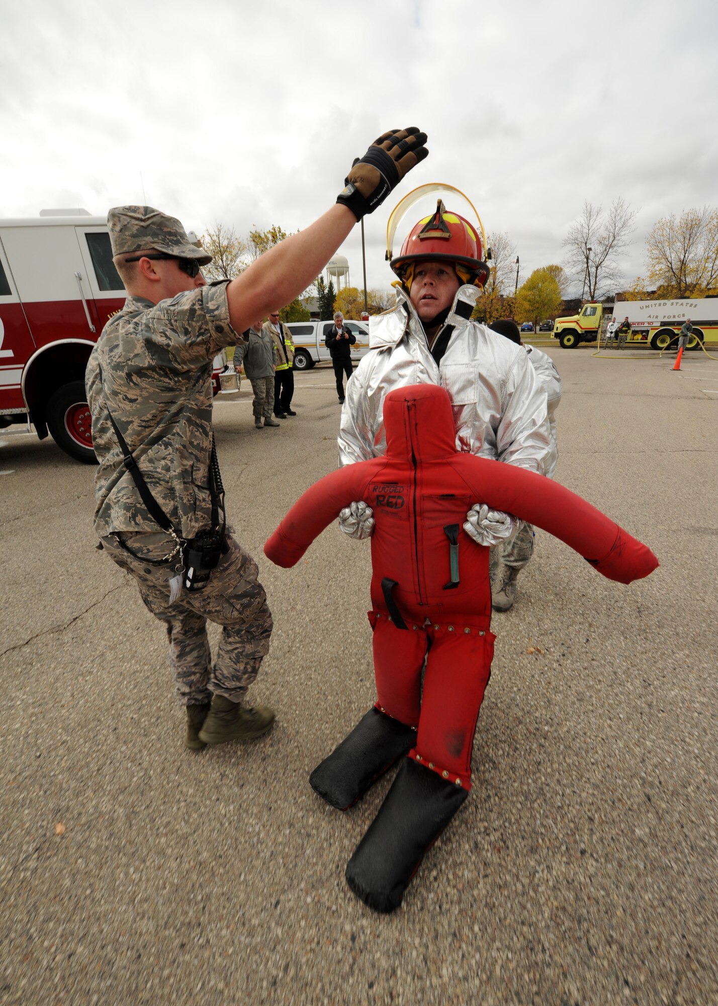 Master Sgt. Kory Henry, 319th Medical Group first sergeant, drags a dummy during the Fire Prevention Week firefighter?s challenge Oct. 8, 2015, on Grand forks Air Force Base, North Dakota. The Rugged Red Drag Rescue Dummy weighed approximately 150 pounds and gave participants an understanding of how heavy a person can be when unconscious. (U.S. Air Force photo by Airman 1st Class Ryan Sparks/Released)