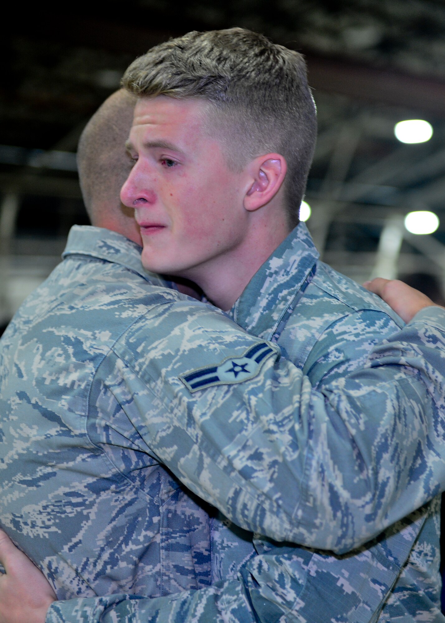 Airmen 1st Class Alexander Ferry and Daniel Saari , both assigned to the 48th Equipment Maintenance Squadron, support one another during the memorial ceremony for Airman 1st Class Darren Phillips, 48th EMS crew chief, at Royal Air Force Lakenheath, England, Oct. 11, 2015. Phillips died from injuries sustained in a motorcycle accident on Oct. 2. (U.S. Air Force photo by Staff Sgt. Stephanie Longoria/Released)