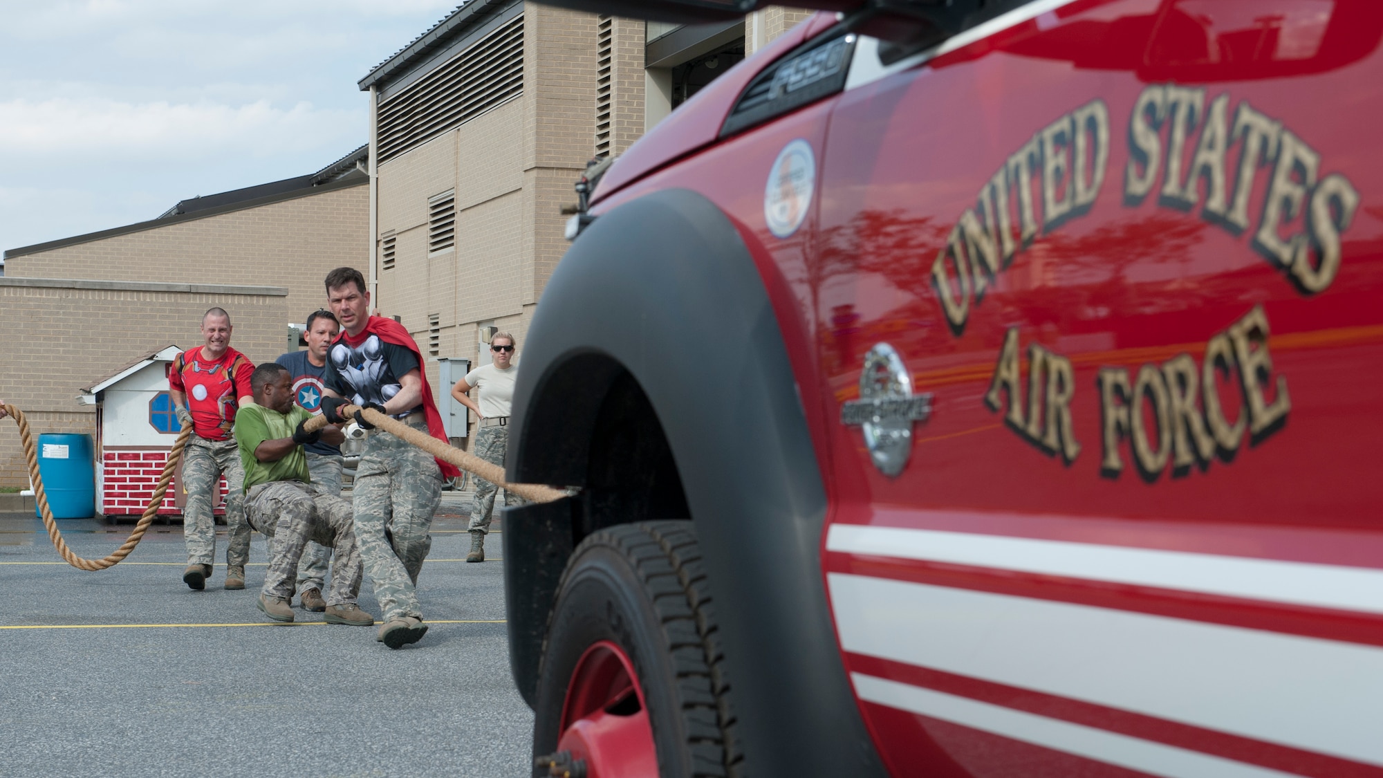 The Chiefs Group team pulls a fire department pickup truck during the 2015 Fire Muster Oct. 8, 2015, at Dover Air Force Base, Del. The muster was organized and hosted by the Dover AFB Fire Department as part of Fire Prevention Week. (U.S. Air Force photo/Senior Airman Zachary Cacicia)