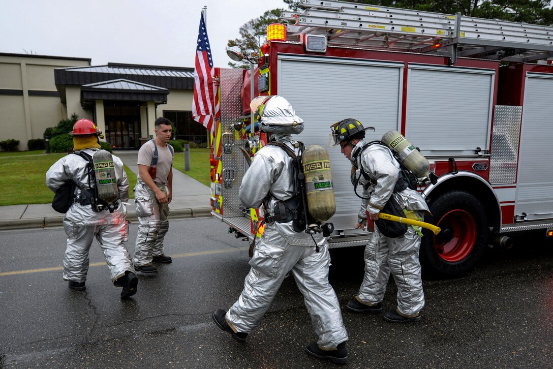 Firefighters from the 4th Civil Engineer Squadron respond to a call at the base gym, Sept. 25, 2015, at Seymour Johnson Air Force Base, North Carolina. Roughly 70 Airmen at the fire department are responsible for more than 13,000 personnel and more than 100 aircraft on base. (U.S. Air Force photo/Airman 1st Class Ashley Williamson)