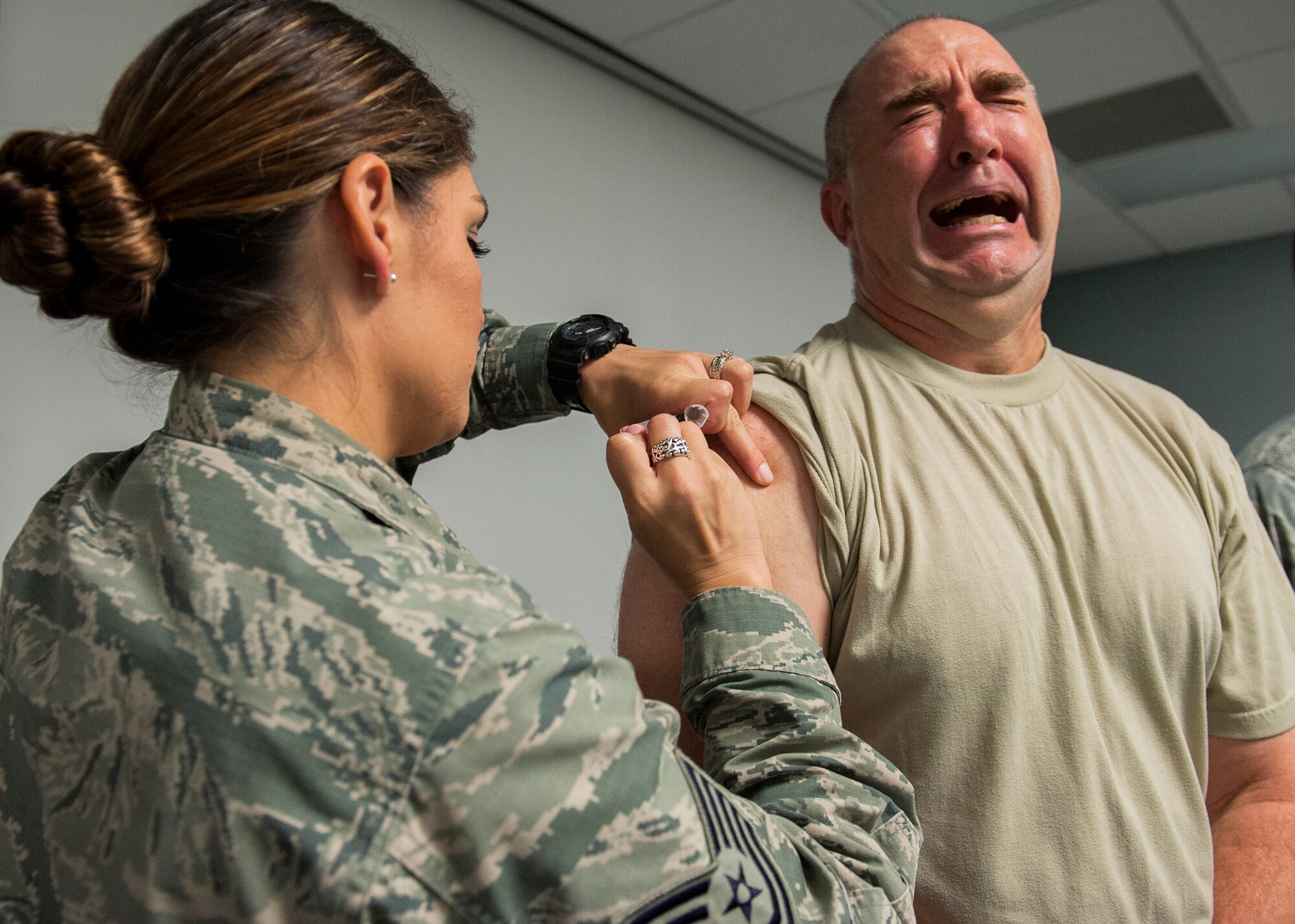 Col. Eric North, 96th Maintenance Group commander, grimaces as he receives a flu vaccination Oct. 8 at Eglin Air Force Base, Fla. A mass influenza vaccine line for active duty only is Oct. 26-29 at building 439 from 7 a.m. to 5 p.m. and Oct. 30 from 7 a.m. to 1 p.m. on a first-come, first-serve basis. The auditorium is located on West F Avenue, across from the library on the East side of the base. Immunization is key to flu prevention and recommended for everyone six-months of age and older.  (U.S. Air Force photo/Ilka Cole)