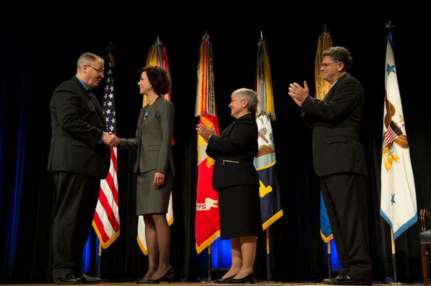 Deputy Secretary of Defense Bob Work presents Lynda Rutledge, Program Executive Officer for Agile Combat Support, Air Force Life Cycle Management Center, with the DOD Distinguished National Civilian of the Year award, during the Department of Defense David O. Cooke Excellence in Public Administration and Distinguished Civilian Service Awards Ceremony at the Pentagon, Oct. 8, 2015. (DoD photo by Senior Master Sgt. Adrian Cadiz)
