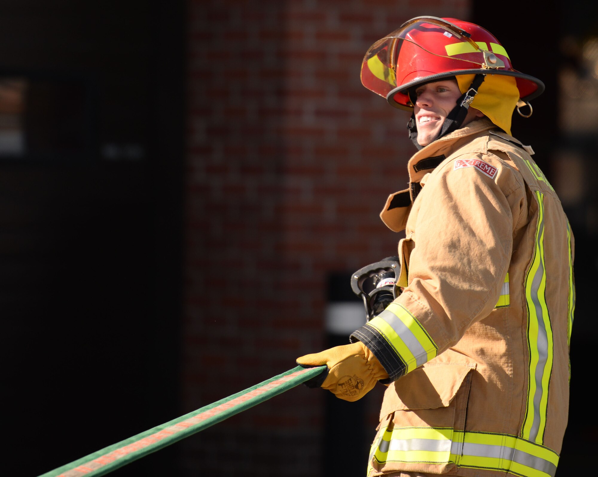 U.S. Air Force Senior Airman Joshua Slater, 100th Civil Engineer Squadron Water Fuels Systems Maintenance journeyman, takes part in the fire muster competition Oct. 8, 2015, on RAF Mildenhall, England. Teams completed nine stations during the competition as part of Fire Prevention Week. (U.S. Air Force photo by Gina Randall/Released)