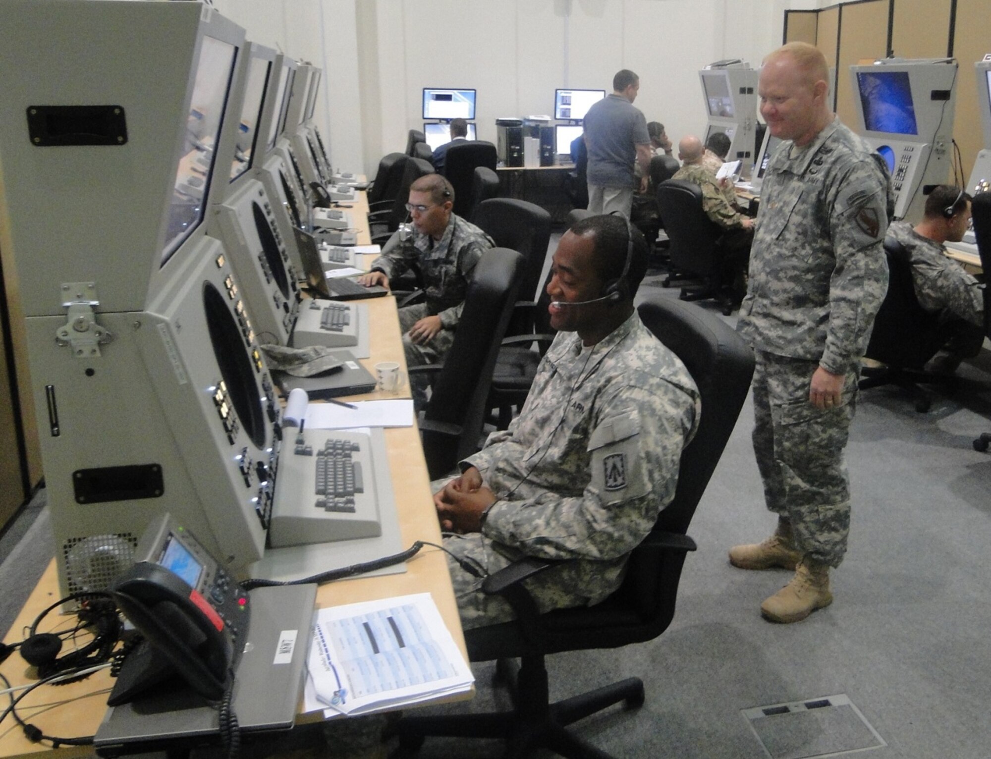 U.S. Soldiers and Airmen from the 380th Air Expeditionary Wing and 1st Battalion, 7th Air Defense Artillery and host nation service members participate in Hawk Exercise 7 inside the Combined Air Warfare Center at an undisclosed location in Southwest Asia Sept. 17, 2015. The primary objective of the exercise was to evaluate and improve the integrated Air and Missile Defense interoperability between U.S. and host nation forces. (Courtesy photo)