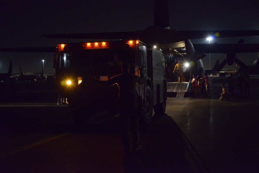 A P-19 Aircraft Rescue Fire Fighting vehicle is driven onto a C-130H assigned to the 746th Expeditionary Airlift Squadron October 12, 2015 at Al Udeid Air Base, Qatar. Aircrew from the 746th EAS received help from Airmen of the 8th Expeditionary Air Mobility Squadron to load the P-19 ARFF vehicle that will be used at a Forward Operating Base. (U.S. Air Force photo/Staff Sgt. Alexandre Montes)