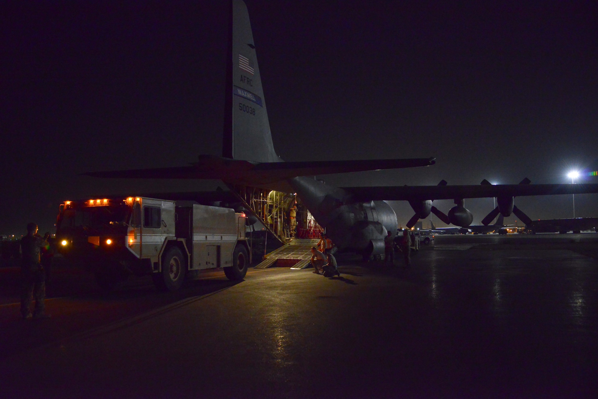 A P-19 Aircraft Rescue Fire Fighting vehicle is driven onto a C-130J assigned to the 746th Expeditionary Airlift Squadron October 12, 2015 at Al Udeid Air Base, Qatar. Aircrew from the 746th EAS received help from Airmen of the 8th Expeditionary Air Mobility Squadron to load the P-19 ARFF vehicle that will be used at a Forward Operating Base. (U.S. Air Force photo/Staff Sgt. Alexandre Montes)