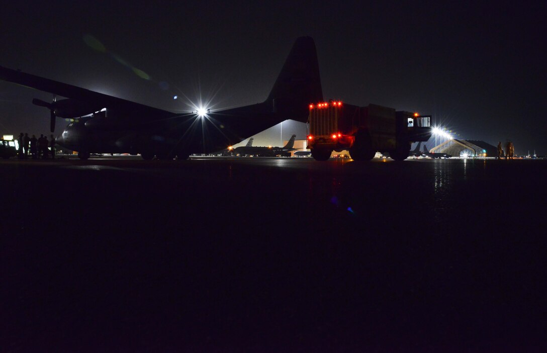 A P-19 Aircraft Rescue Fire Fighting vehicle is parked and ready to be loaded onto a C-130J Hercules assigned to the 746th Expeditionary Airlift Squadron October 12, 2015 at Al Udeid Air Base, Qatar. Aircrew from the 746th EAS received help from Airmen of the 8th Expeditionary Air Mobility Squadron to load the P-19 ARFF vehicle that will be used at a Forward Operating Base. (U.S. Air Force photo/Staff Sgt. Alexandre Montes)