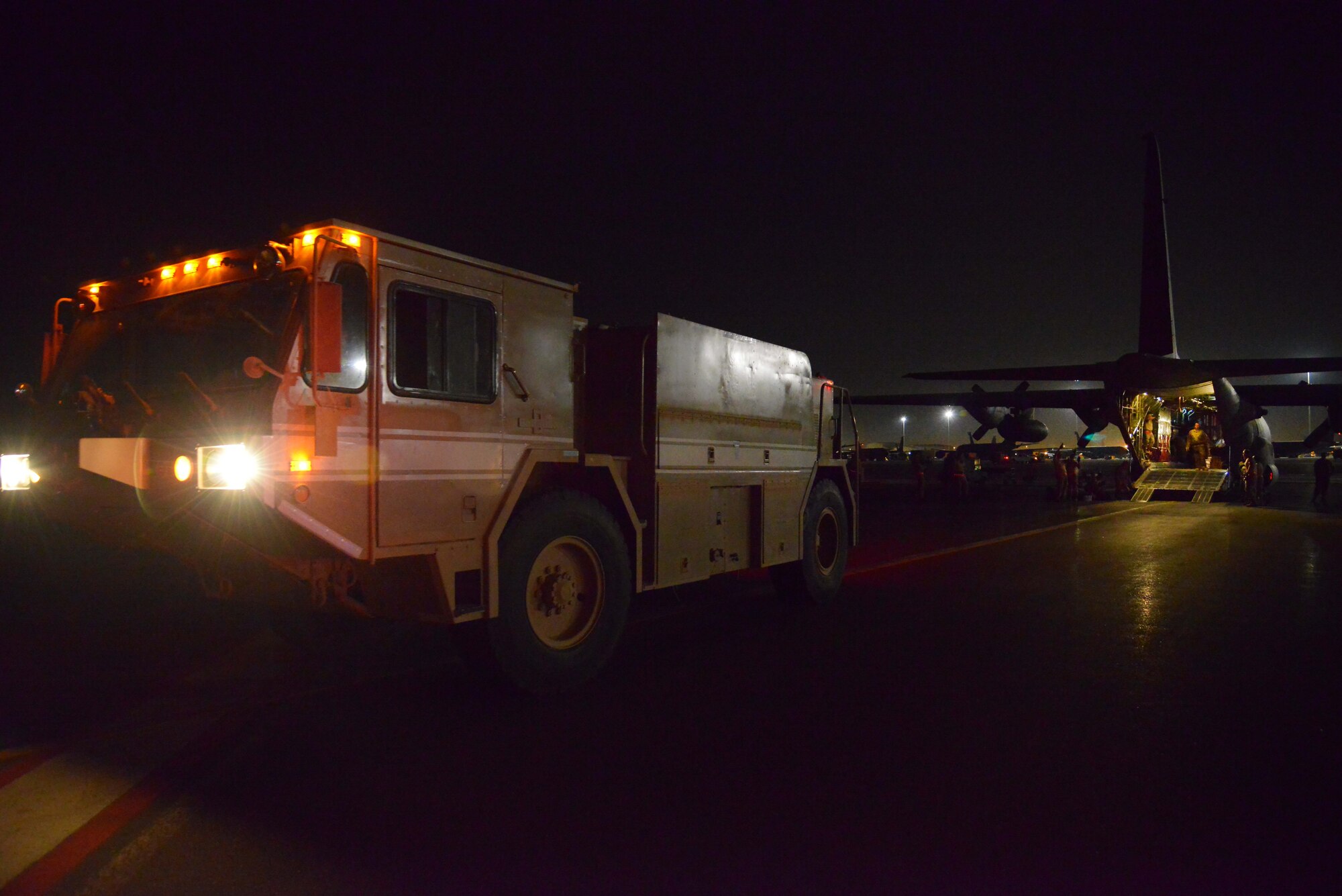 A P-19 Aircraft Rescue Fire Fighting vehicle is driven onto a C-130J assigned to the 746th Expeditionary Airlift Squadron October 12, 2015 at Al Udeid Air Base, Qatar. Aircrew from the 746th EAS received help from Airmen of the 8th Expeditionary Air Mobility Squadron to load the P-19 ARFF vehicle that will be used at a Forward Operating Base. (U.S. Air Force photo/Staff Sgt. Alexandre Montes)